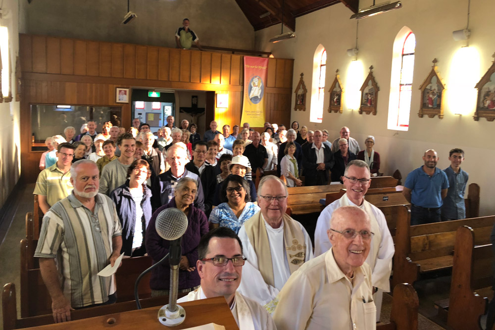 Fr Dominic Byrne, Fr Paul Bateman, Fr Mick McAndrew and Fr Tony Percy with Marian devotees at Cobargo. Photo: supplied.
