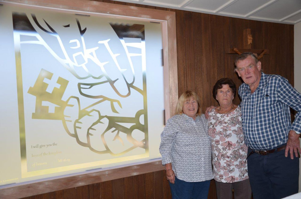 Lesley Nagle, Gail Johns and Kevin King alongside the new etched window at St Peter’s Church Binda.