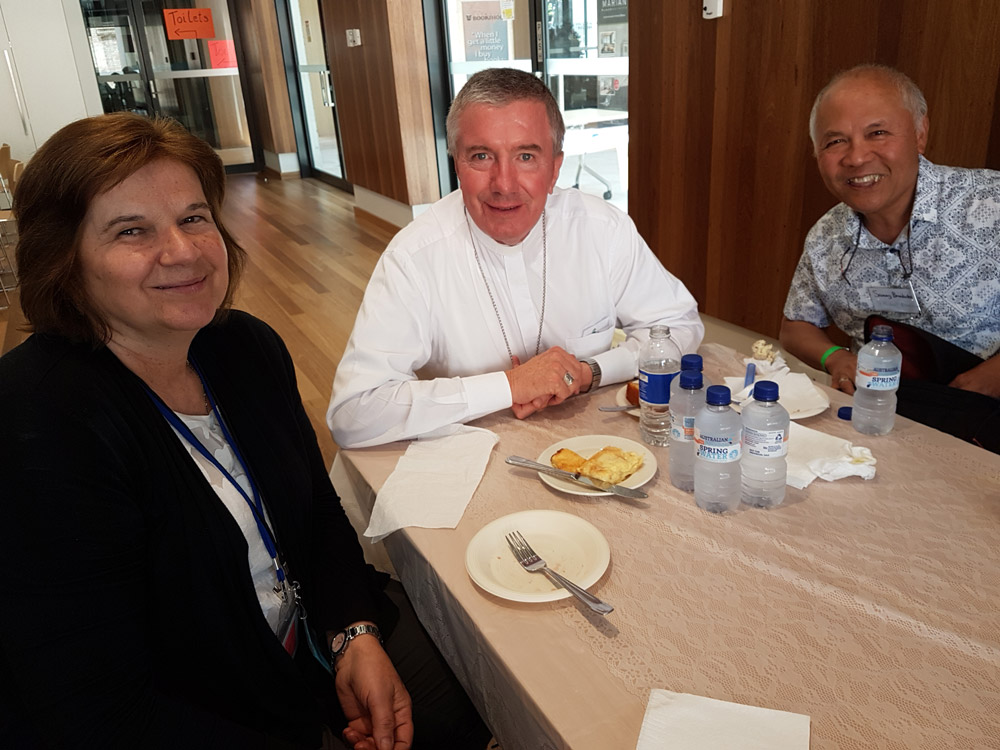 Archbishop Christopher Prowse (centre) with Neda Kesina and Sam Benedictos from the El Shaddai community at last year's Day of Teaching.