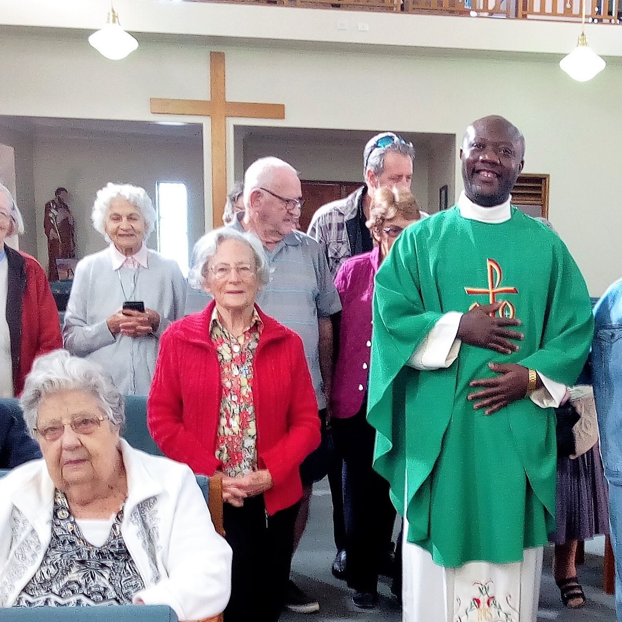 Fr Matthias Ogwo with members of the Rockhampton Catholic community